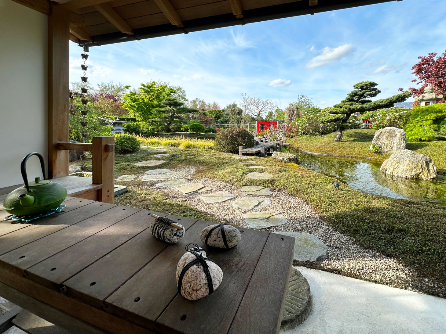 Overview of a Japanese strolling garden in spring from the Koshikake