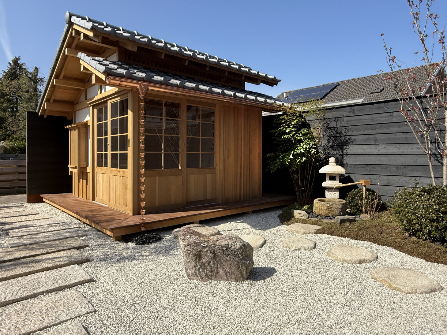 Tsukubai water feature in a Japanese Roji tea garden next to the tea house