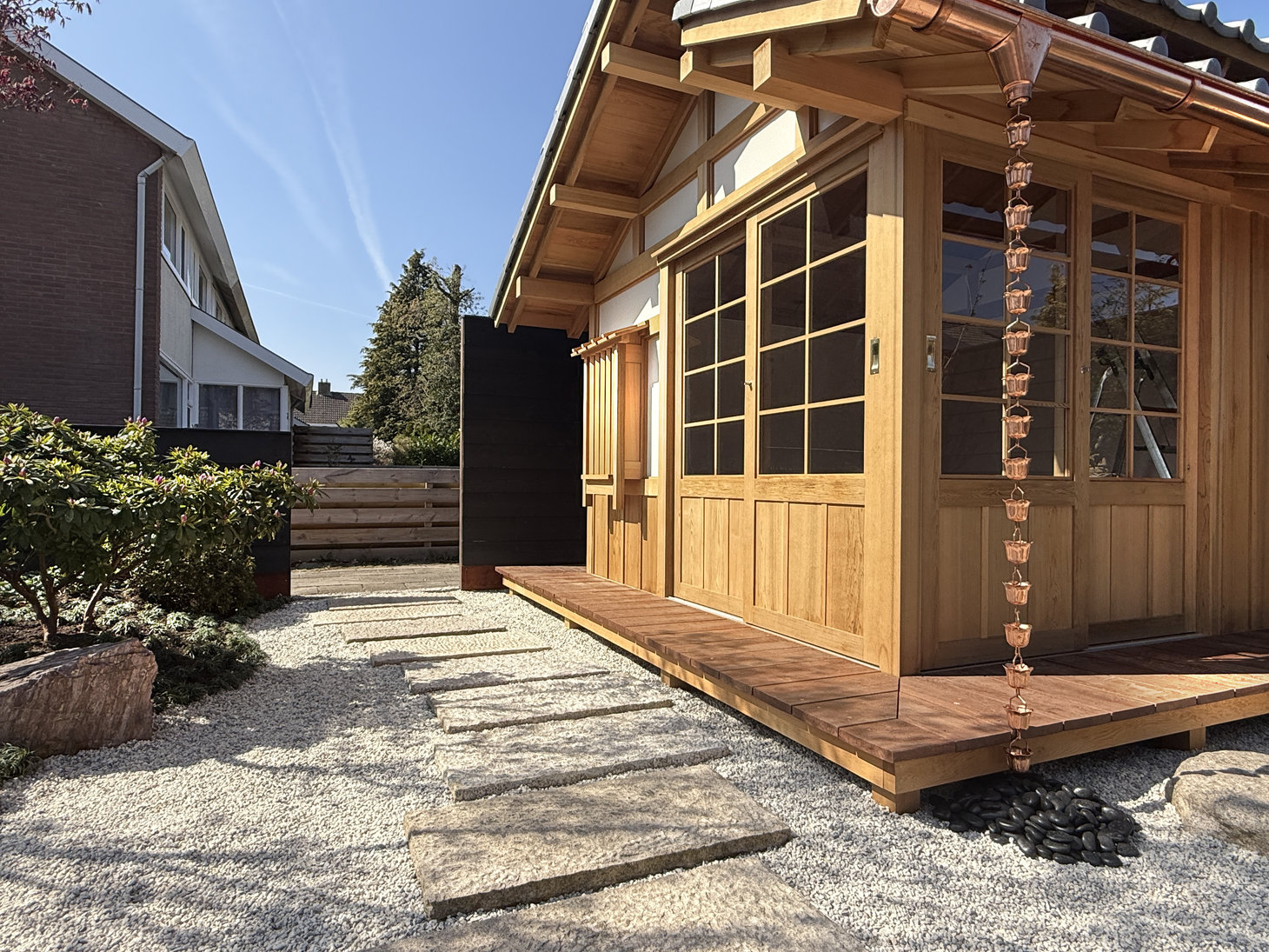 Japanese Tea House with a rain chain in a Roji tea garden